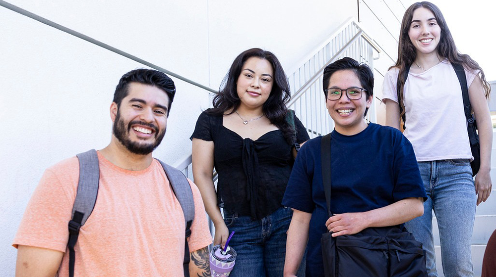 Smiling students with backpacks